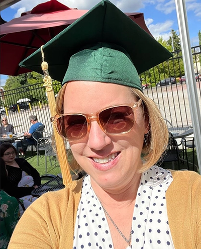 Heather Decker selfie in graduation cap